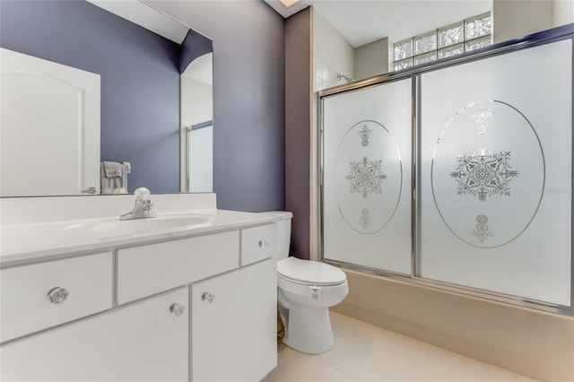 21 Webster Ln, Palm Coast, FL 32164 - bathroom featuring toilet, vanity, and shower / bath combination with glass door