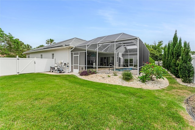 21 Webster Ln, Palm Coast, FL 32164 - back of house featuring a patio, a gate, glass enclosure, an outdoor pool, and stucco siding