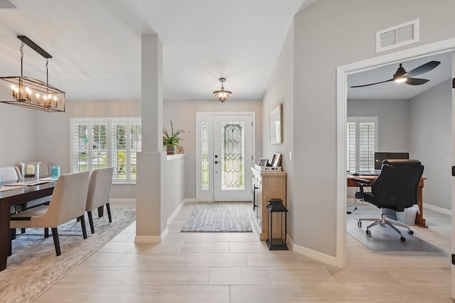 70 Esperanto Dr, Palm Coast, FL 32164 - foyer with a chandelier and baseboards