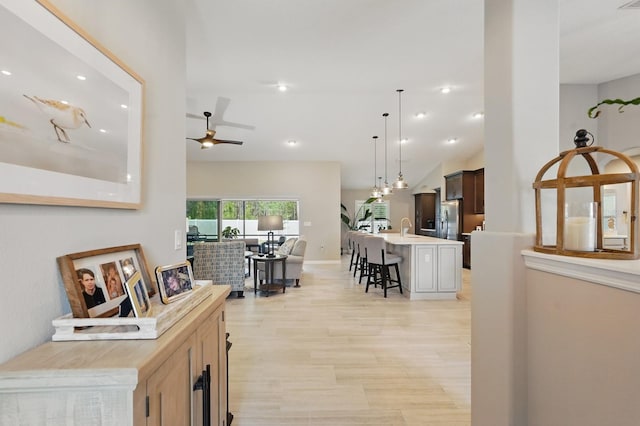 70 Esperanto Dr, Palm Coast, FL 32164 - corridor with light wood-type flooring, recessed lighting, and a sink