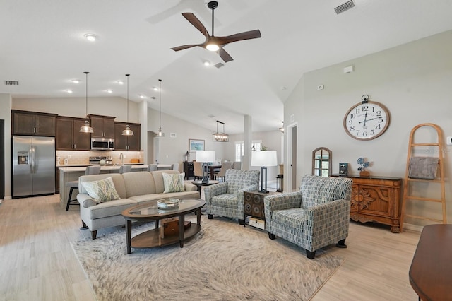 70 Esperanto Dr, Palm Coast, FL 32164 - living room featuring light wood finished floors, ceiling fan, and high vaulted ceiling