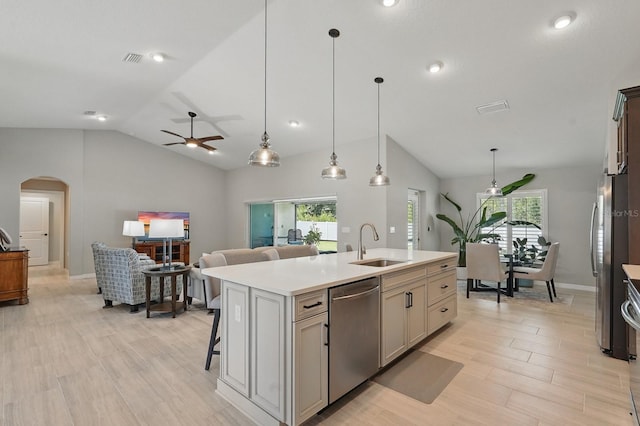 70 Esperanto Dr, Palm Coast, FL 32164 - kitchen featuring stainless steel appliances, lofted ceiling, a sink, a ceiling fan, and arched walkways
