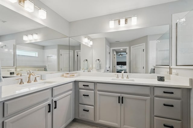 70 Esperanto Dr, Palm Coast, FL 32164 - ensuite bathroom featuring double vanity, tiled shower, and ceiling fan