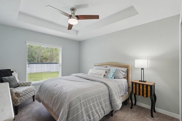 70 Esperanto Dr, Palm Coast, FL 32164 - bedroom with carpet flooring, a raised ceiling, baseboards, and a ceiling fan