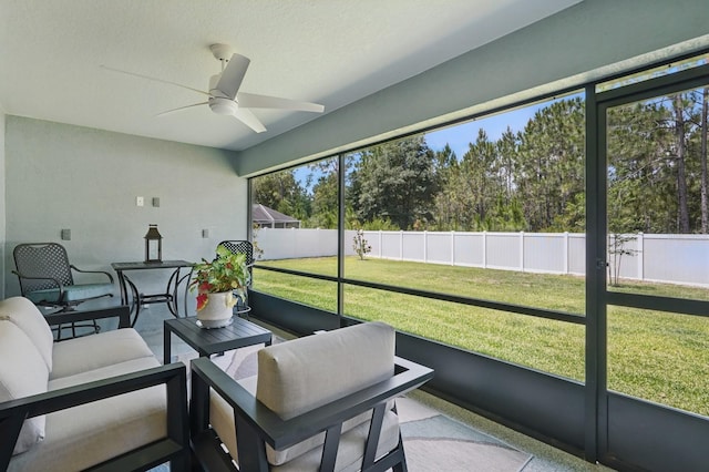 70 Esperanto Dr, Palm Coast, FL 32164 - sunroom featuring a ceiling fan, an outdoor living space, and view of scattered trees