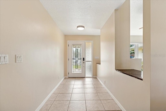 16 S Claymont Ct S, Palm Coast, FL 32137 - doorway to outside with a textured ceiling and light tile patterned flooring