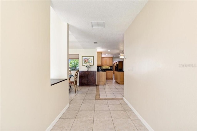 16 S Claymont Ct S, Palm Coast, FL 32137 - hall featuring light tile patterned floors and a textured ceiling