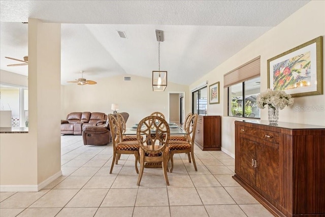 16 S Claymont Ct S, Palm Coast, FL 32137 - dining area featuring a ceiling fan, vaulted ceiling, light tile patterned flooring, and a textured ceiling