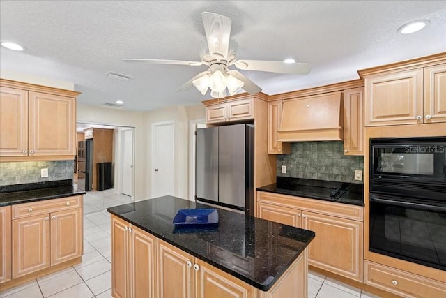 16 S Claymont Ct S, Palm Coast, FL 32137 - kitchen with black appliances, premium range hood, light tile patterned flooring, backsplash, and light brown cabinetry