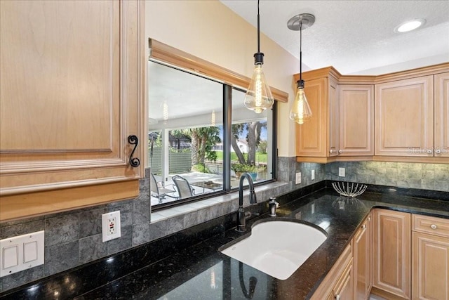 16 S Claymont Ct S, Palm Coast, FL 32137 - kitchen featuring light brown cabinetry, tasteful backsplash, hanging light fixtures, and dark stone counters