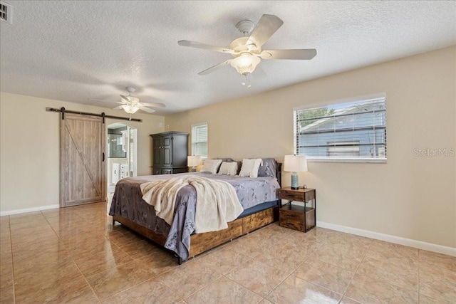 16 S Claymont Ct S, Palm Coast, FL 32137 - bedroom featuring a barn door, a textured ceiling, a ceiling fan, and light tile patterned floors
