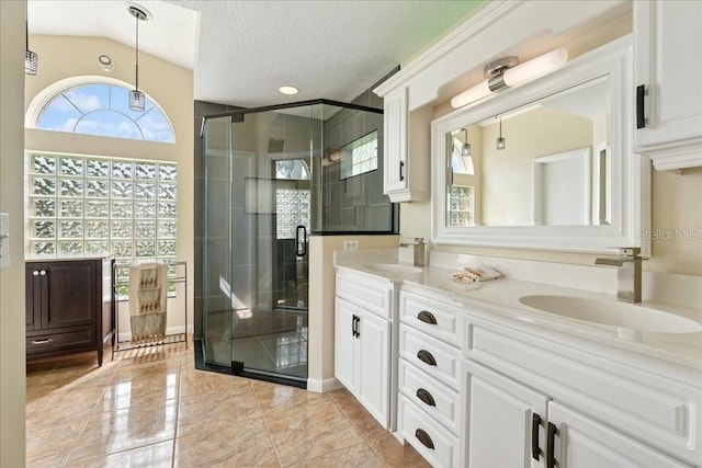 16 S Claymont Ct S, Palm Coast, FL 32137 - bathroom with double vanity, a stall shower, a textured ceiling, and marble finish flooring