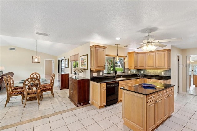 16 S Claymont Ct S, Palm Coast, FL 32137 - kitchen with dishwasher, light tile patterned floors, healthy amount of natural light, dark countertops, and a textured ceiling