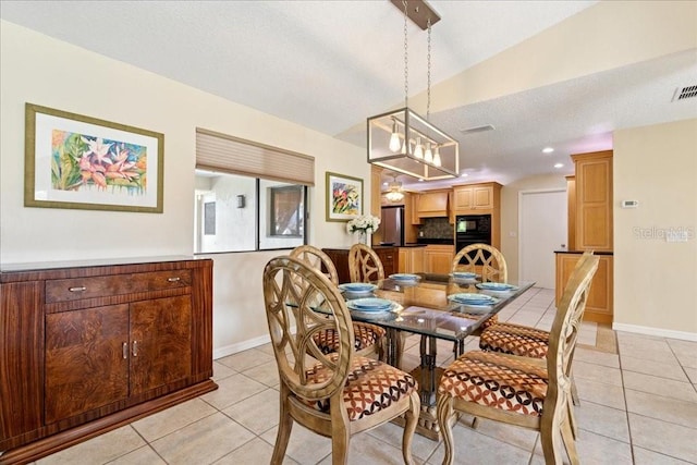 16 S Claymont Ct S, Palm Coast, FL 32137 - dining room with light tile patterned flooring and a chandelier