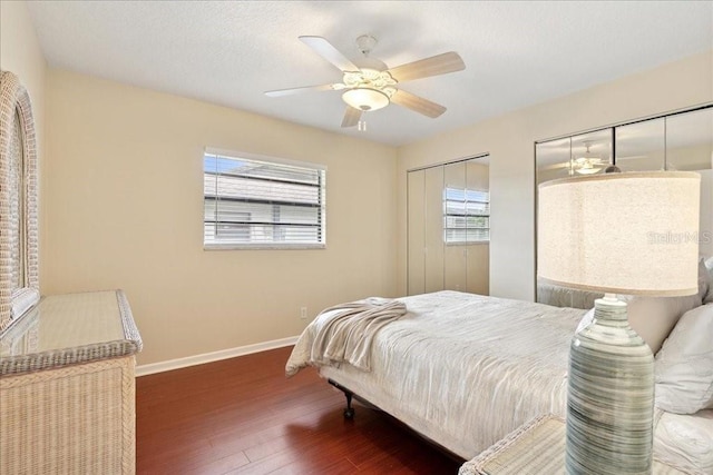 16 S Claymont Ct S, Palm Coast, FL 32137 - bedroom featuring multiple windows, wood finished floors, a ceiling fan, and multiple closets
