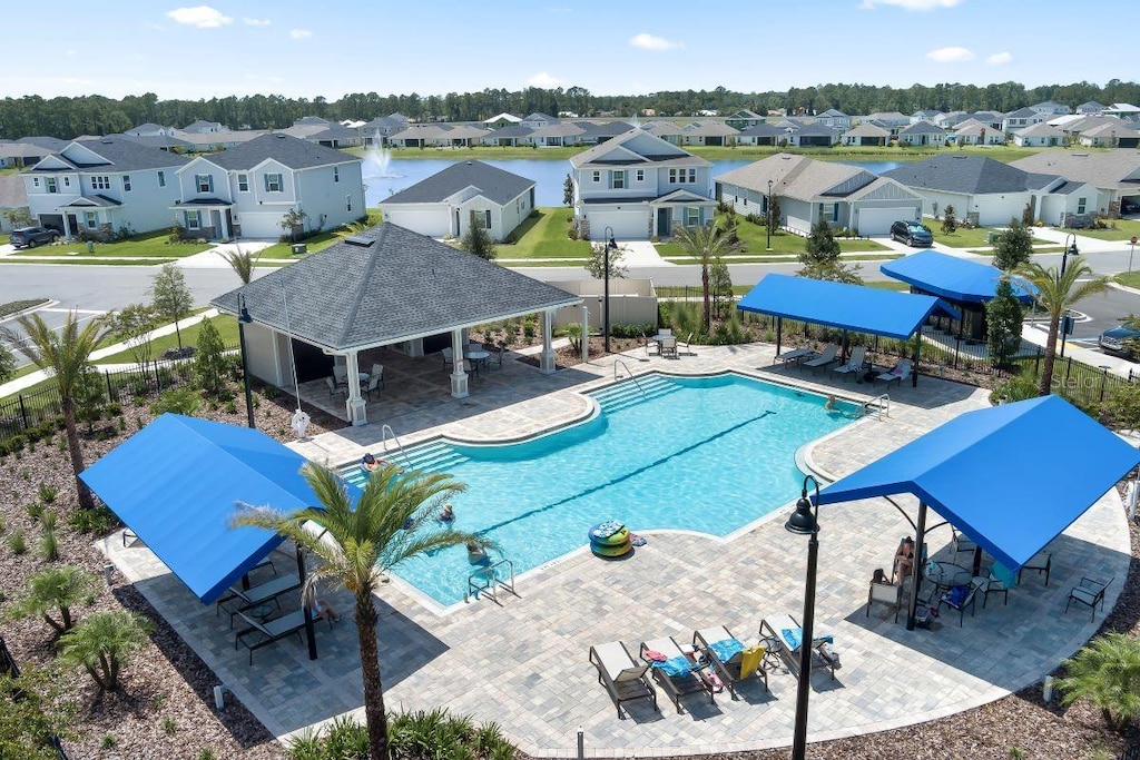 97 Waverly Ln, Palm Coast, FL 32164 - community pool with a residential view, a gazebo, and a patio