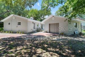 4901 Sailfish Dr, Ponce Inlet, FL 32127 - view of front of house with an attached garage