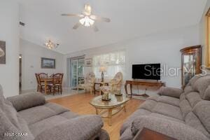 54 Price Ln, Palm Coast, FL 32164 - living area with wood finished floors, a ceiling fan, and lofted ceiling