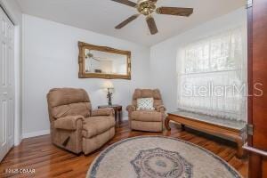 54 Price Ln, Palm Coast, FL 32164 - sitting room with wood finished floors, baseboards, and a ceiling fan