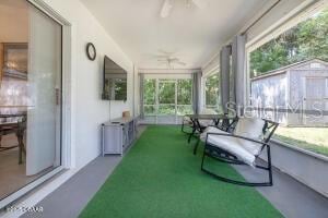 54 Price Ln, Palm Coast, FL 32164 - sunroom / solarium featuring a ceiling fan