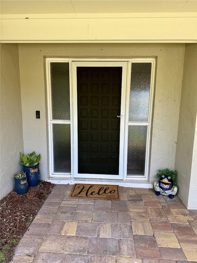 9 Cotton Ct, Palm Coast, FL 32137 - entrance to property with stucco siding