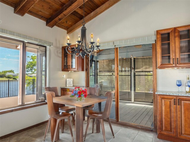 9 Cotton Ct, Palm Coast, FL 32137 - dining room with wood ceiling, a chandelier, and light tile patterned flooring
