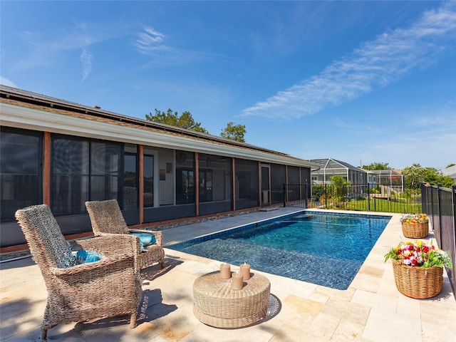 9 Cotton Ct, Palm Coast, FL 32137 - view of pool with a sunroom and a patio area