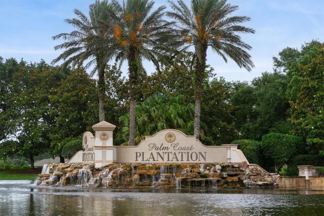 80 N Lakewalk Dr, Palm Coast, FL 32137 - community / neighborhood sign featuring a water view and view of scattered trees