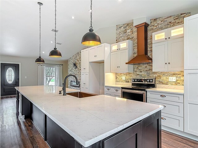 14 Zollinger Pl, Palm Coast, FL 32164 - kitchen featuring stainless steel range with electric stovetop, wall chimney range hood, a sink, a large island, and lofted ceiling