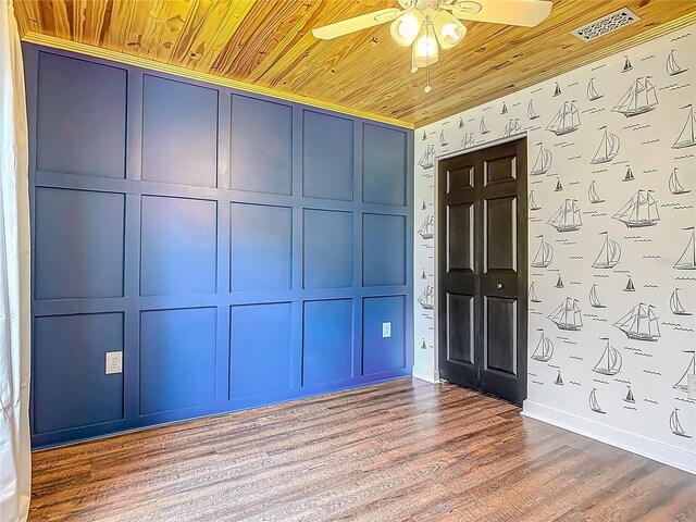 14 Zollinger Pl, Palm Coast, FL 32164 - foyer entrance with wood ceiling, ceiling fan, a decorative wall, wood finished floors, and baseboards