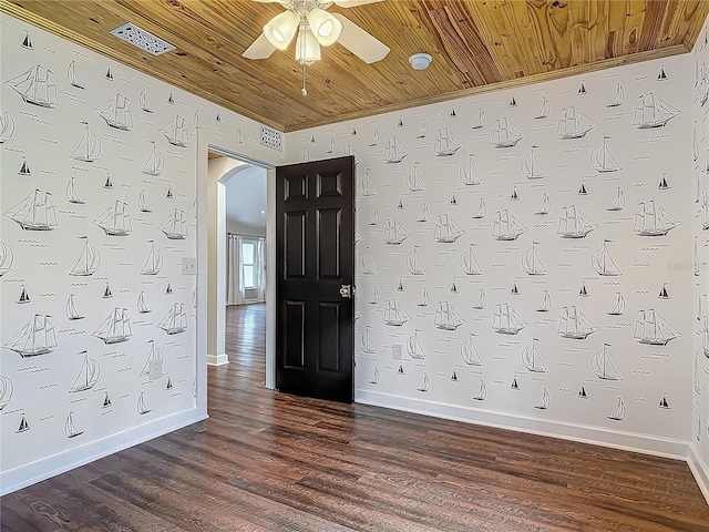 14 Zollinger Pl, Palm Coast, FL 32164 - empty room featuring arched walkways, ceiling fan, wooden ceiling, dark wood finished floors, and baseboards