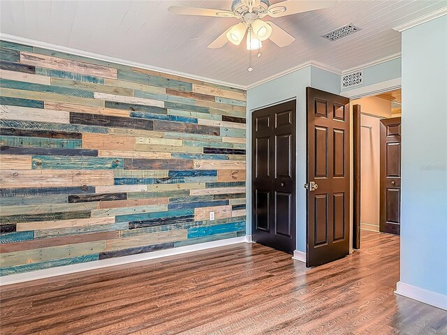 14 Zollinger Pl, Palm Coast, FL 32164 - interior space featuring wooden walls, ceiling fan, ornamental molding, wood finished floors, and baseboards