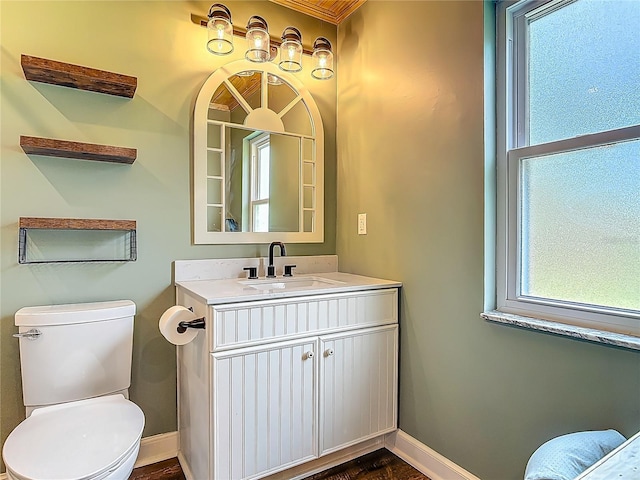 14 Zollinger Pl, Palm Coast, FL 32164 - bathroom featuring vanity, toilet, and baseboards