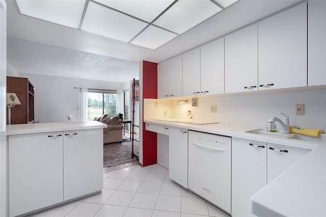 55 Village Cir, Palm Coast, FL 32164 - kitchen with white dishwasher, light countertops, open floor plan, white cabinets, and a sink