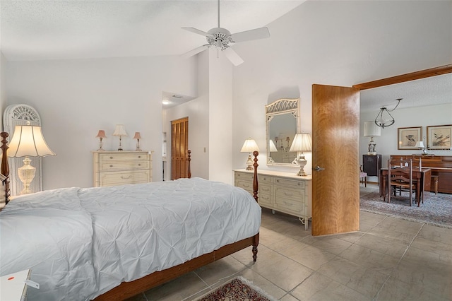 55 Village Cir, Palm Coast, FL 32164 - bedroom featuring high vaulted ceiling, a textured ceiling, and a ceiling fan