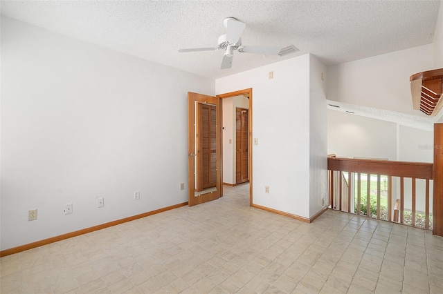 55 Village Cir, Palm Coast, FL 32164 - unfurnished room featuring ceiling fan, baseboards, and a textured ceiling