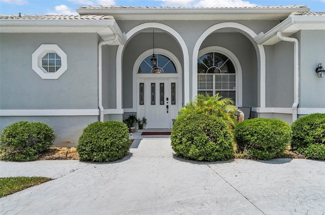 80 Flemingwood Ln, Palm Coast, FL 32137 - entrance to property with stucco siding