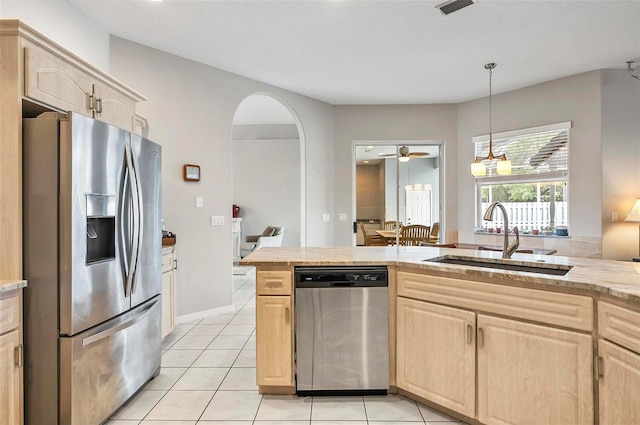 80 Flemingwood Ln, Palm Coast, FL 32137 - kitchen featuring appliances with stainless steel finishes, light brown cabinets, a sink, and ceiling fan