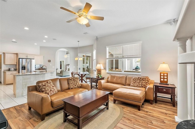 80 Flemingwood Ln, Palm Coast, FL 32137 - living area featuring a ceiling fan, arched walkways, light wood-style flooring, and recessed lighting