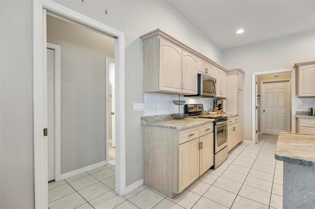80 Flemingwood Ln, Palm Coast, FL 32137 - kitchen with appliances with stainless steel finishes, tasteful backsplash, light tile patterned floors, light countertops, and recessed lighting