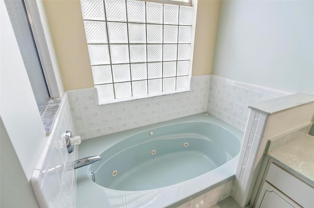 80 Flemingwood Ln, Palm Coast, FL 32137 - full bathroom with a jetted tub and vanity