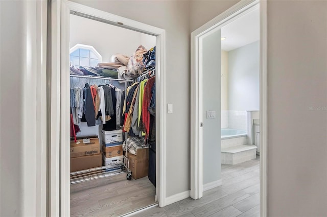 80 Flemingwood Ln, Palm Coast, FL 32137 - walk in closet with wood finished floors
