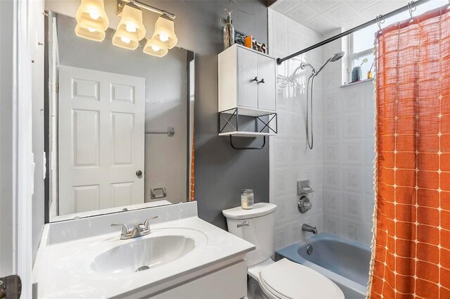 80 Flemingwood Ln, Palm Coast, FL 32137 - bathroom with toilet, vanity, shower / bathtub combination with curtain, and a chandelier