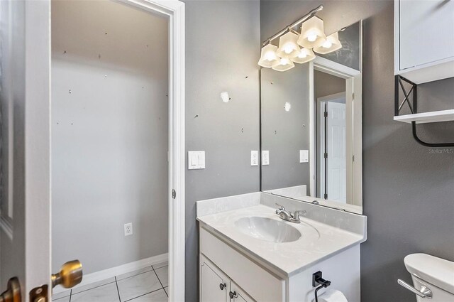 80 Flemingwood Ln, Palm Coast, FL 32137 - bathroom with toilet, vanity, tile patterned flooring, a chandelier, and baseboards