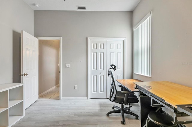 80 Flemingwood Ln, Palm Coast, FL 32137 - office area with light wood finished floors, plenty of natural light, and baseboards