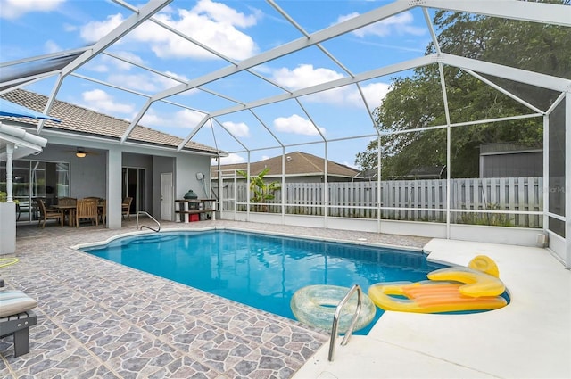 80 Flemingwood Ln, Palm Coast, FL 32137 - view of pool featuring a patio area, outdoor dining area, a ceiling fan, and glass enclosure
