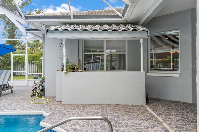 80 Flemingwood Ln, Palm Coast, FL 32137 - outdoor pool with glass enclosure and a patio