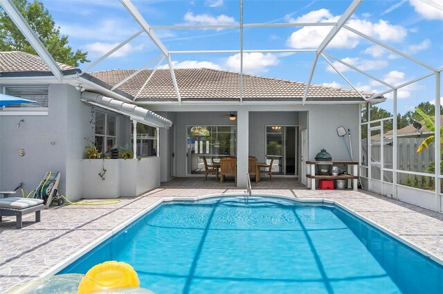 80 Flemingwood Ln, Palm Coast, FL 32137 - outdoor pool with a patio, a lanai, and a ceiling fan