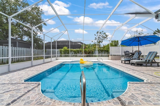 80 Flemingwood Ln, Palm Coast, FL 32137 - view of swimming pool featuring a patio and glass enclosure
