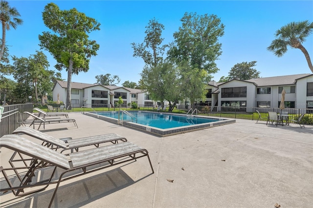 1 Tomoka Oaks Blvd Unit 135, Ormond Beach, FL 32174 - community pool featuring a patio and a residential view